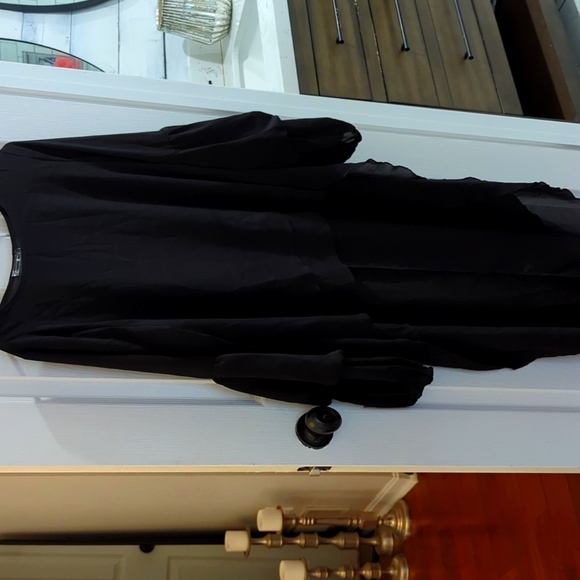 This is a high low dress/shirt, size medium in black chiffon. Smoke free. - Picture 1 of 4